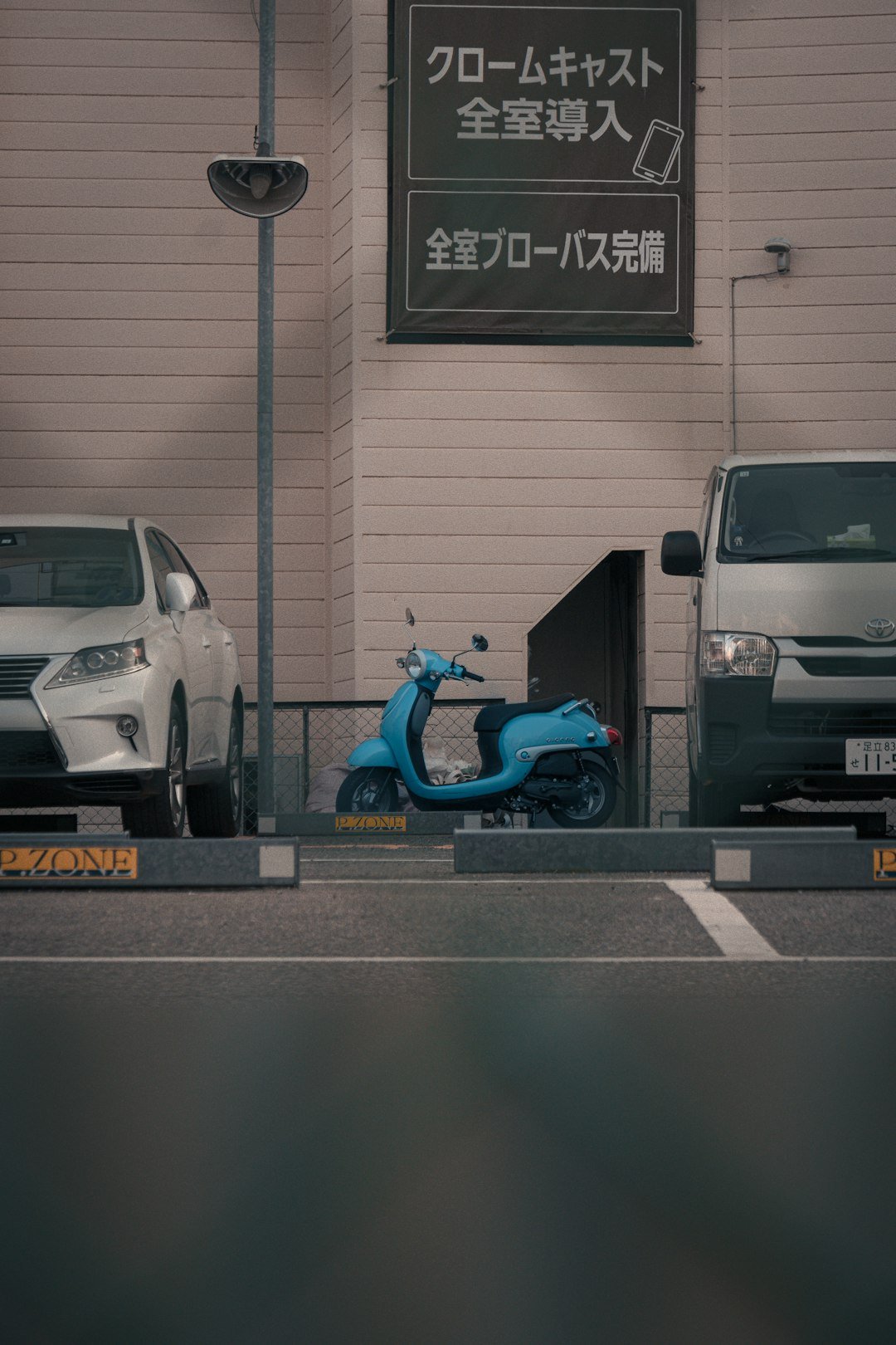 A scooter is parked in front of a building