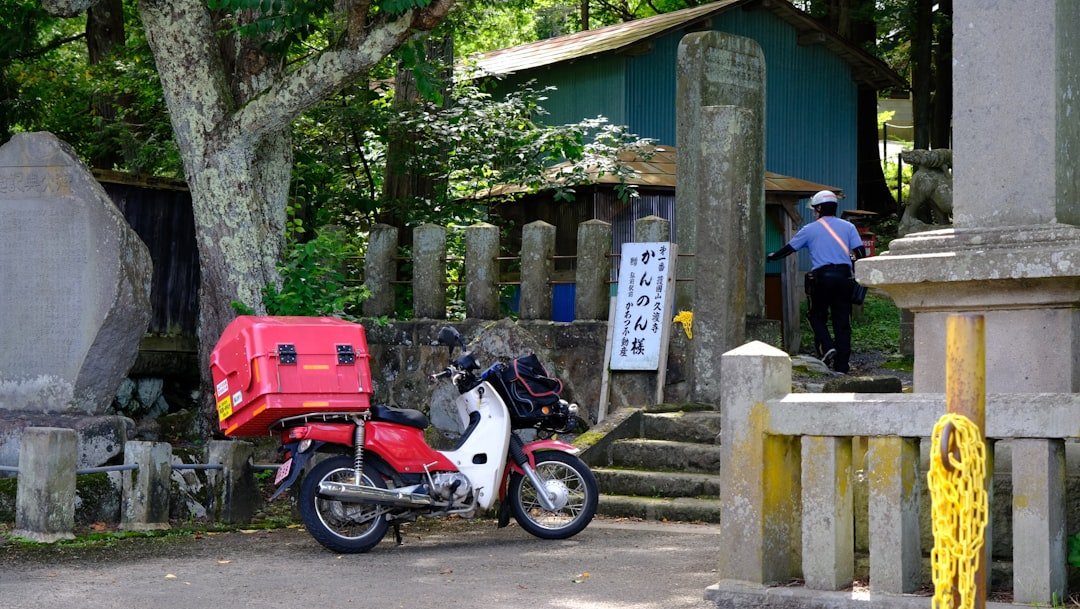 a person standing next to a motorcycle