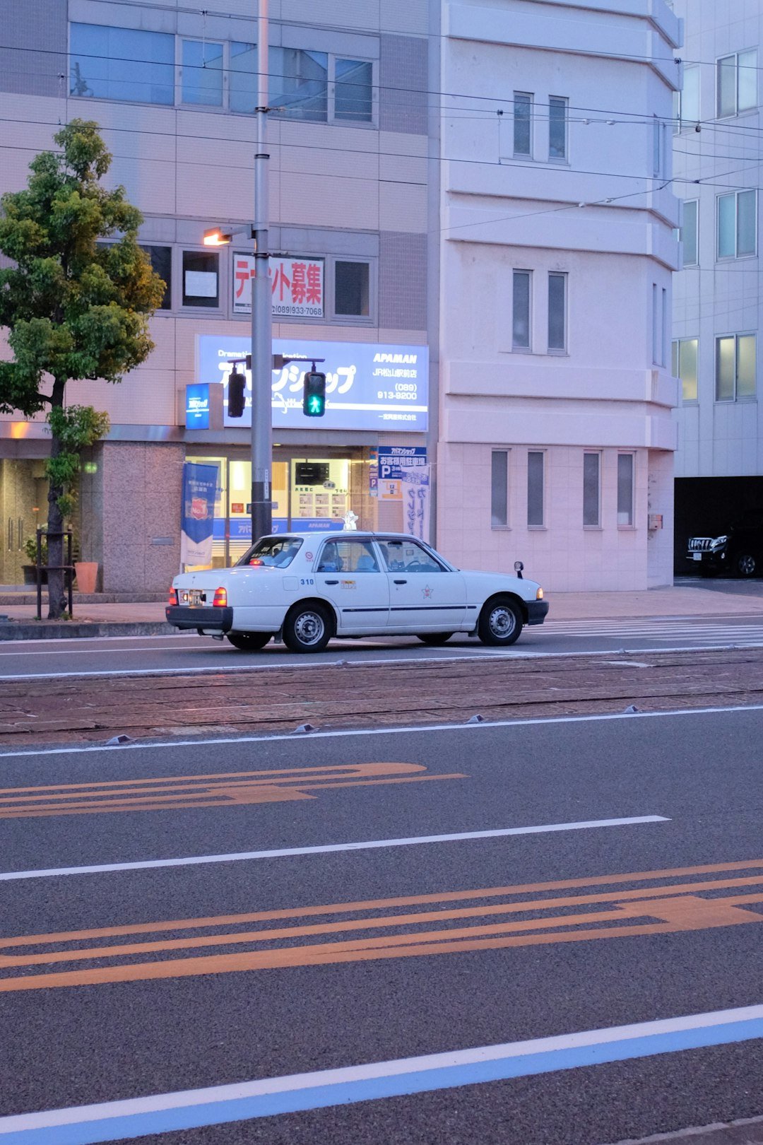 yellow sedan on road during daytime