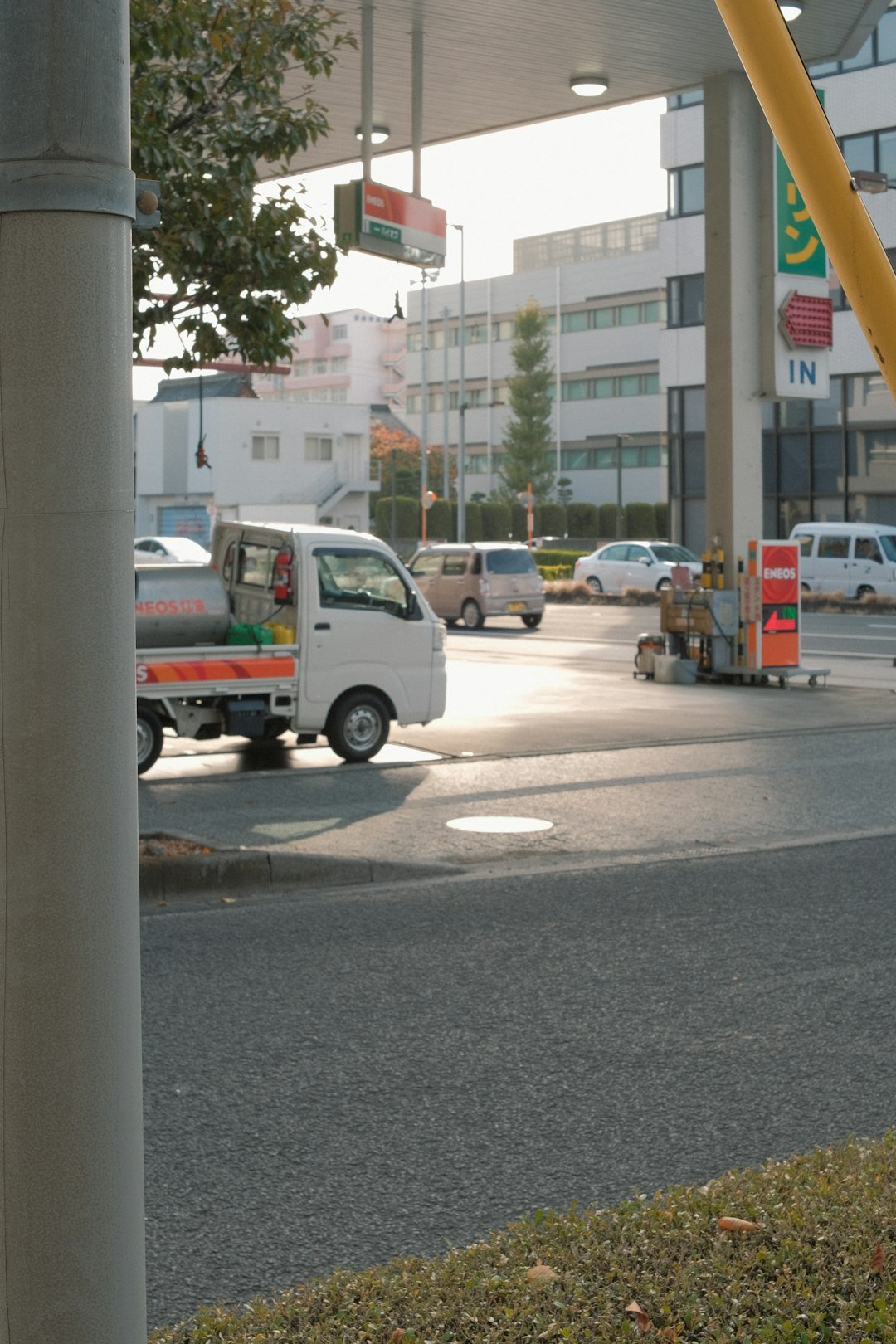 a white truck parked on the side of a road