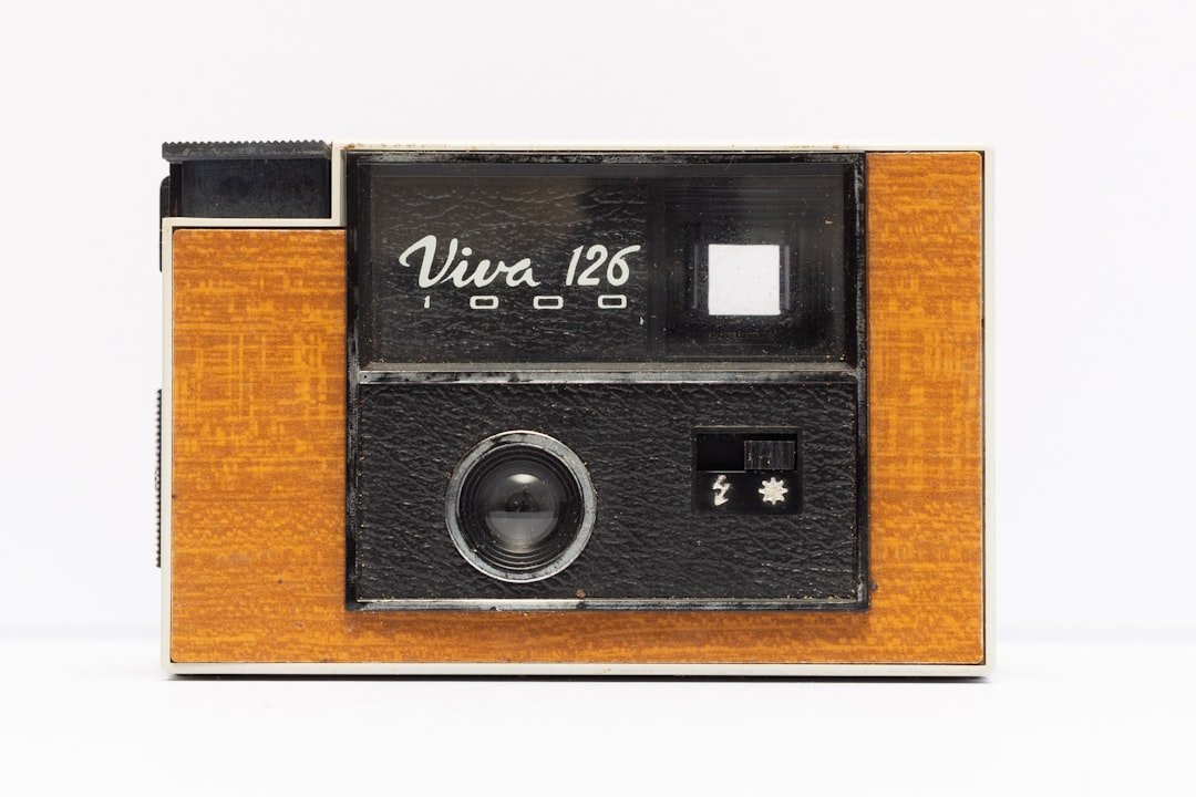 an old fashioned camera with a wooden case
