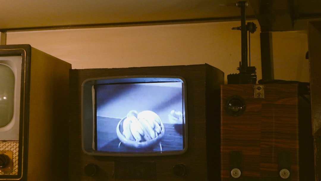 An old fashioned television sitting next to a wall