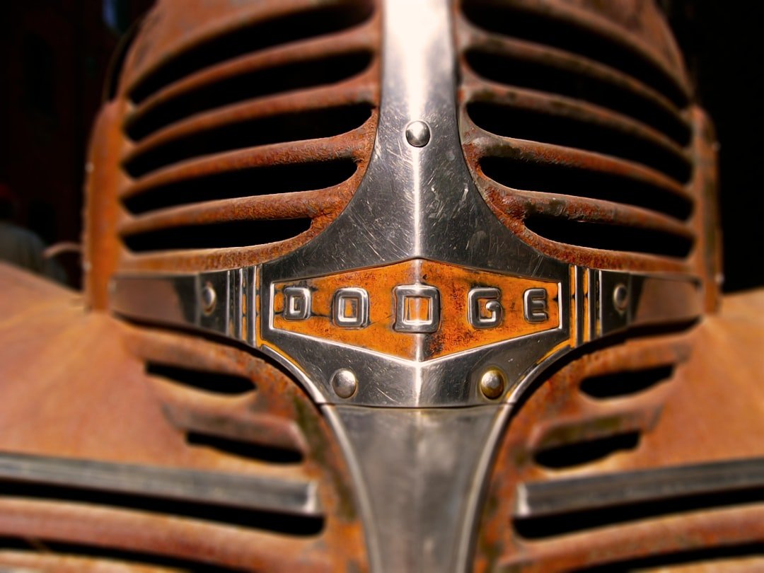 Rusty chrome grille of old dodge car.