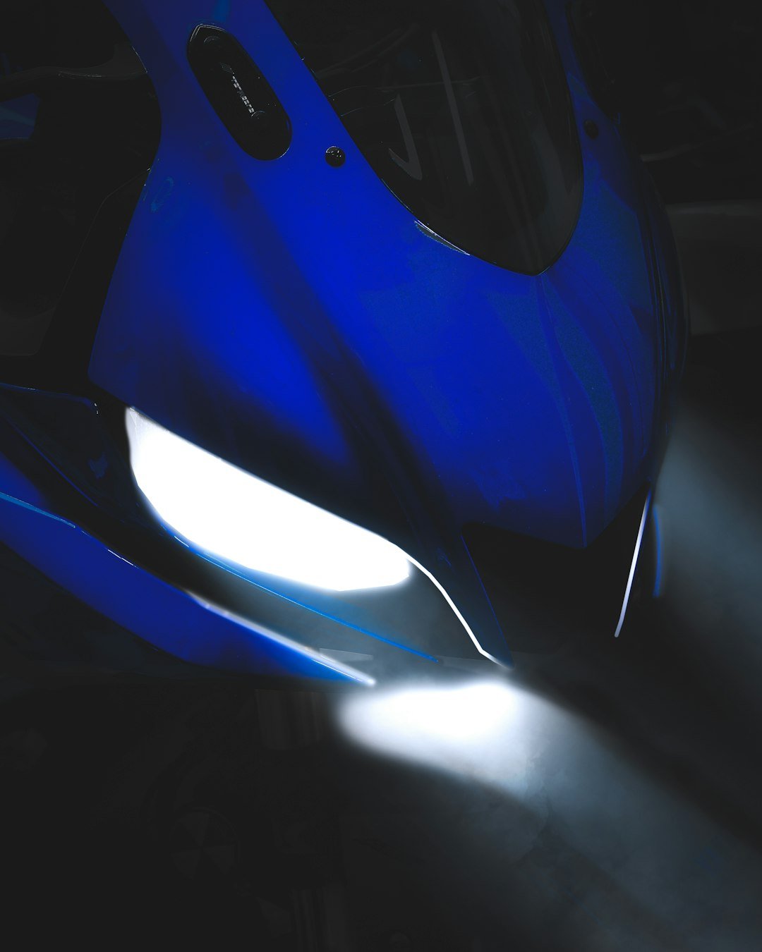 a blue light in a dark room