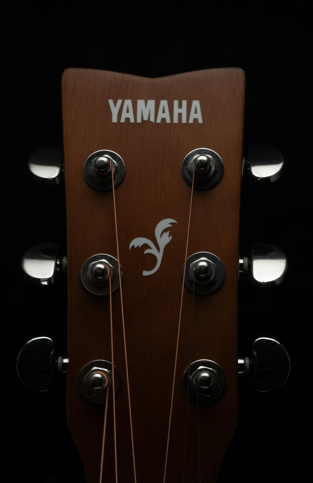 The headstock of a yamaha guitar.