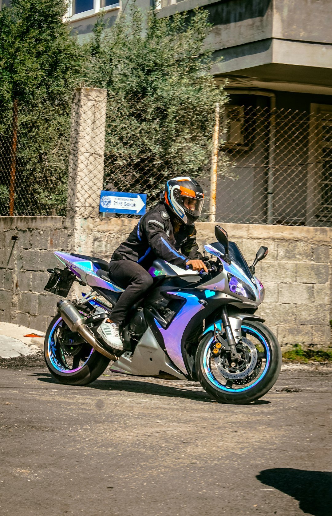 a person riding a motorcycle on a city street
