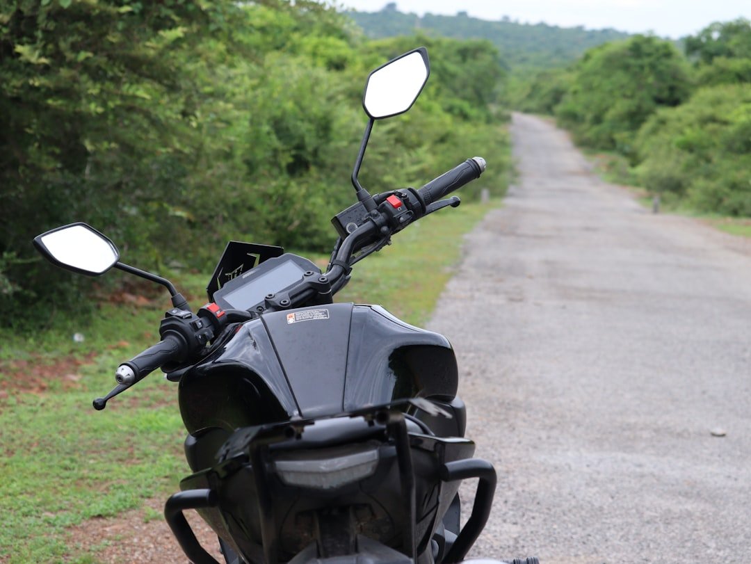 a motorcycle parked on the side of a road